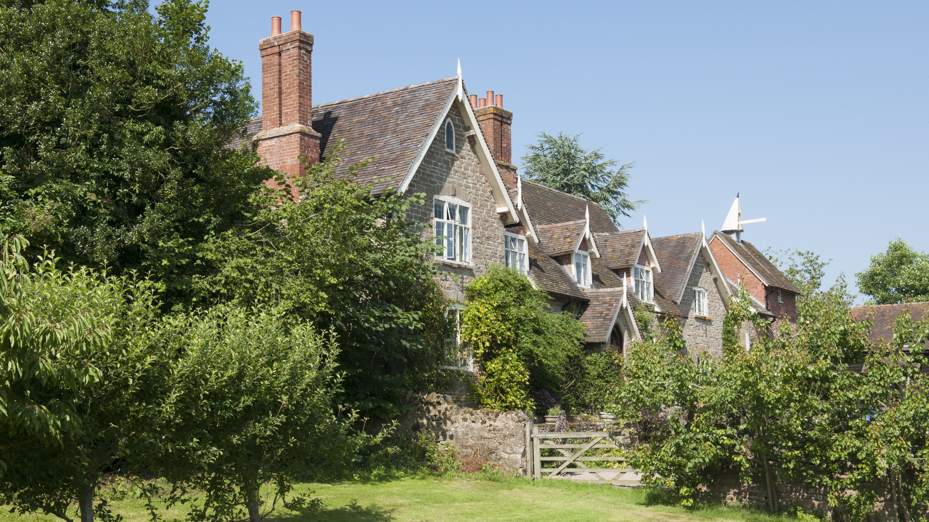 Traditional UK terraced houses with tiled roofs